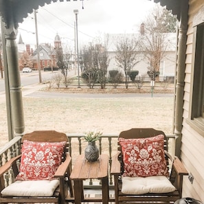 Enjoy coffee on the front porch before strolling downtown around Big Spring Park
