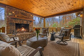 The outdoor deck is a great place to gather all day long.  It has a propane BBQ, a wood-burning fireplace.