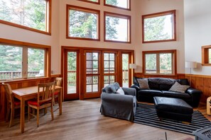 Living Room with Vaulted Ceilings and Windows