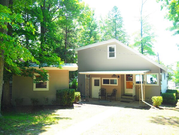 EXTERIOR:  The front of the cottage from the road.