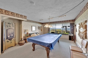 The game room is on the bottom level with a pool table and a spectacular view.