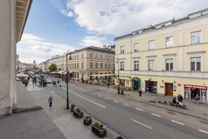 A view of the charming neighborhood with classic architecture, showcasing the location of the apartment.