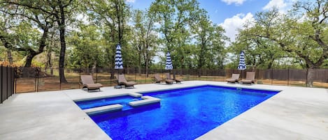The private pool is surrounded by mature oaks - what better way to cool off after a hot day in the sun than taking a dip in this tranquil setting?