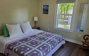 Bright and sunny bedroom with King bed.
