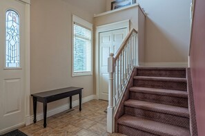 Entryway and Stairs to the Upper Level of the Townhouse 