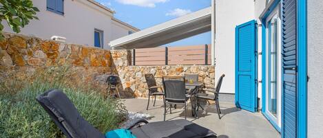 Private terrace with sun louger, garden furniture and BBQ