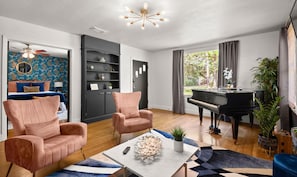 Capture the inviting essence of this home with a view from the living room to the front door, showcasing seamless design and warm hospitality right from the entrance.