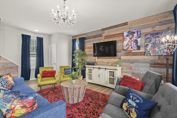 Can’t help but feel the Mississippi blues theme in the Plush charcoal rockers, smooth and comfy retro accent chairs and authentic Mississippi art on ship lap walls.