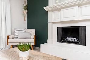 Cozy reading nook next to fireplace (non-functional)