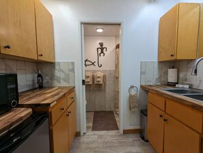 Kitchen with fridge & microwave