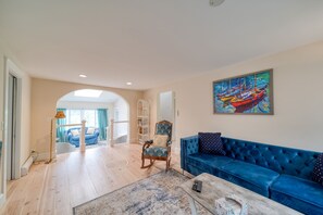 Unwind in our comfortable living area, boasting a comfy sofa and a serene reading nook for your leisure time
