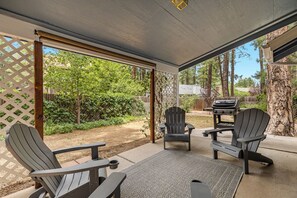 Fenced Backyard with Outdoor Seating, Table and Propane Grill in Patio Shed