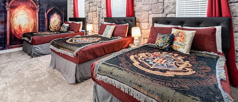 Magical Harry Potter-themed bedroom with three full beds, creating an enchanting space for fans and a comfortable stay