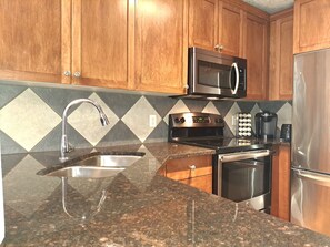 Kitchen (coffee maker/coffee,pots,pans,dishes,glasses, BBQ utensils and more.