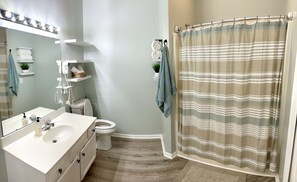 Large full bathroom with large closet and toiletries provided
