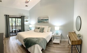 Off the living area is a large bedroom with a king bed and new king mattress.