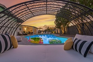 Cozy up poolside on the daybed