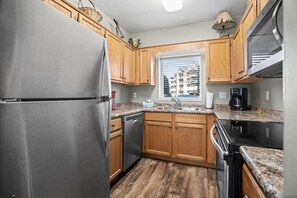 Full kitchen with plenty of pots and pans for making all your meals!
