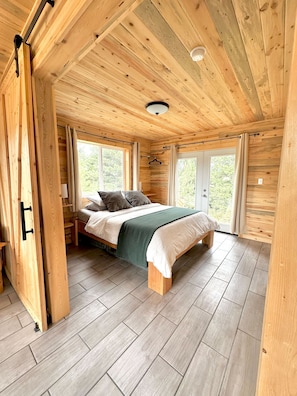 Main bedroom with Queen bed. Sliding door for extra privacy. 