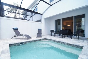 Private dip pool with loungers and shaded seating area