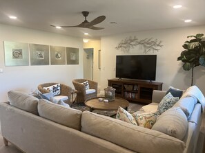 Another view of the living room and large screen smart TV