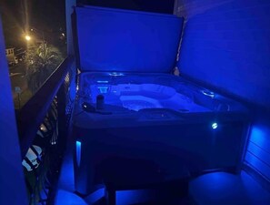 Night view of hot tub. 