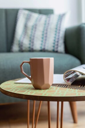 A charming spot with a cozy chair, a small round table, and an inviting ambiance for coffee or reading.