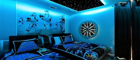 Kids will love the upstairs bedroom with a cool Star War theme!