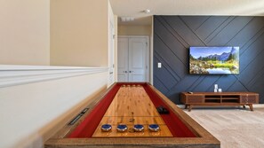 Challenge your friends to shuffleboard in the games loft for a lively and competitive experience