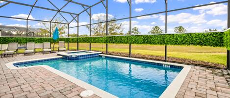 Screened outdoor pool, blending the joys of swimming with a sheltered and private oasis.