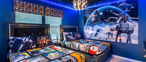 Kids will love the upstairs bedroom with a cool Star Wars theme