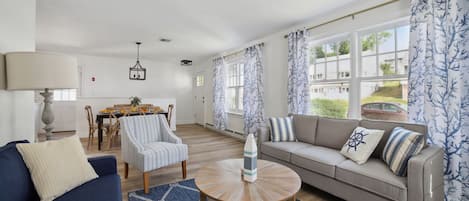 Second living room with natural lighting from the large windows