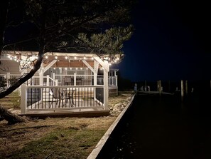 Gazebo adjacent to bay with lights