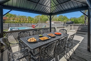 Enjoy peaceful meals out on the back deck while the kiddos safely play in our fenced yard.