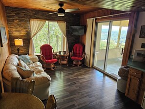 Living room with sliding glass door to porch