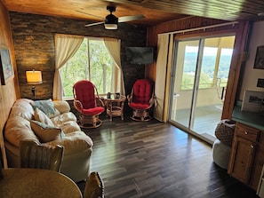 Living room with sliding glass door to porch