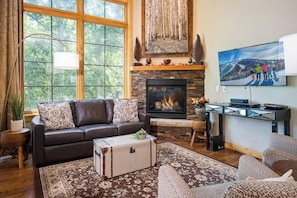 Cozy up next to the gas fireplace and flat screen TV