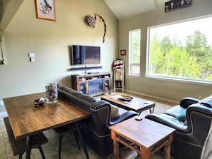 The large farm table is great for dinners or playing games with family. 