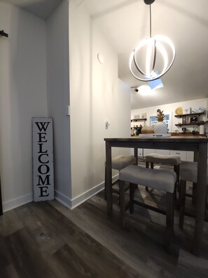 Dining table (4 stools). (4-in-1 high chair can be found in Bedroom 3 closet)