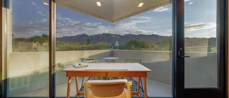 Wow! Bedroom 2's desk and attached patio offer stunning mountain views.