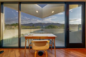 Wow! Bedroom 2's desk and patio offer stunning mountain views