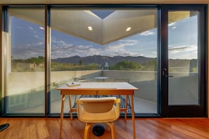 Wow! Bedroom 2's desk and patio offer stunning mountain views