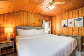 King bedroom with dresser, closet and two nightstands