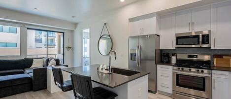 Open layout provides access to a full kitchen and beautiful island
