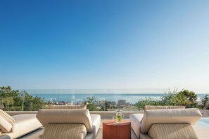 Unwind in the luxe and comfy sun loungers.
