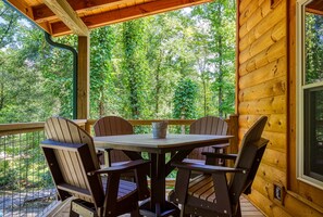 View of woods and outdoor seating area - View of woods and outdoor seating area