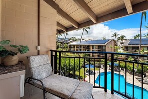 Unwind on our lanai, a peaceful retreat offering sweeping views of the shimmering pool.