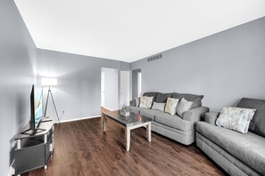 Living room with brand new couch and over sized chair (2)