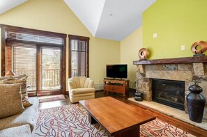 Large stone fireplace is the focus of the room