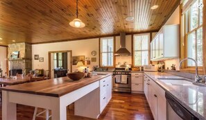 Fully stocked chef’s kitchen with all pots and pans, spices, and condiments